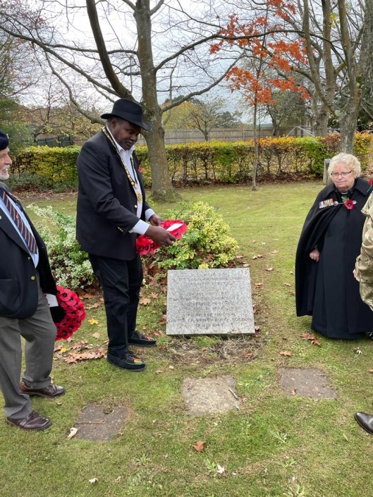 Mayor laying a wreath and Rev Mallas at Canadian Memorial Garden