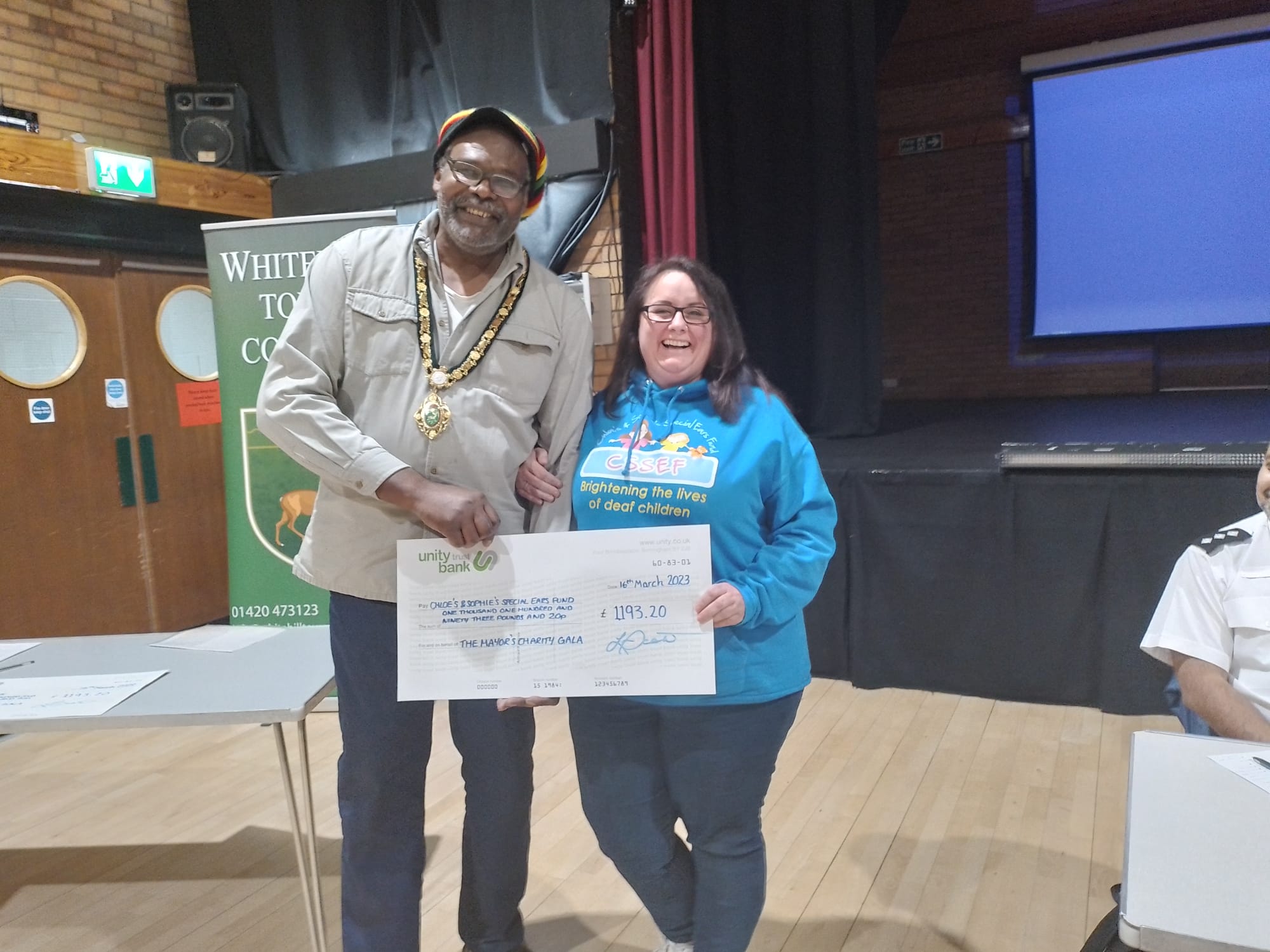Mayor and woman with cheque