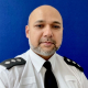 Chief Inspector Rahman wearing police uniform